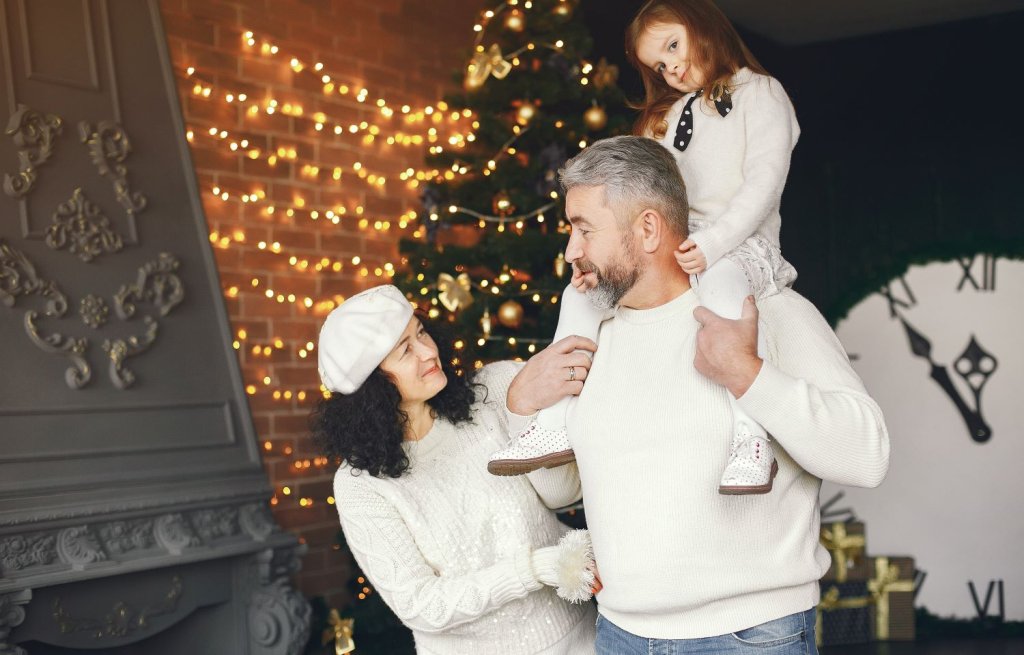 grandparents-with-their-granddaughter-celebrating-christmas-cozy-house2.jpg