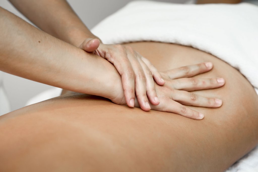 young-woman-receiving-back-massage-spa-center.jpg