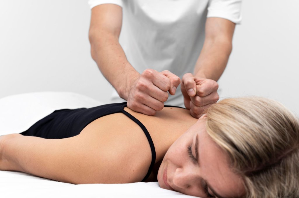 physiotherapist-performing-back-massage-woman.jpg